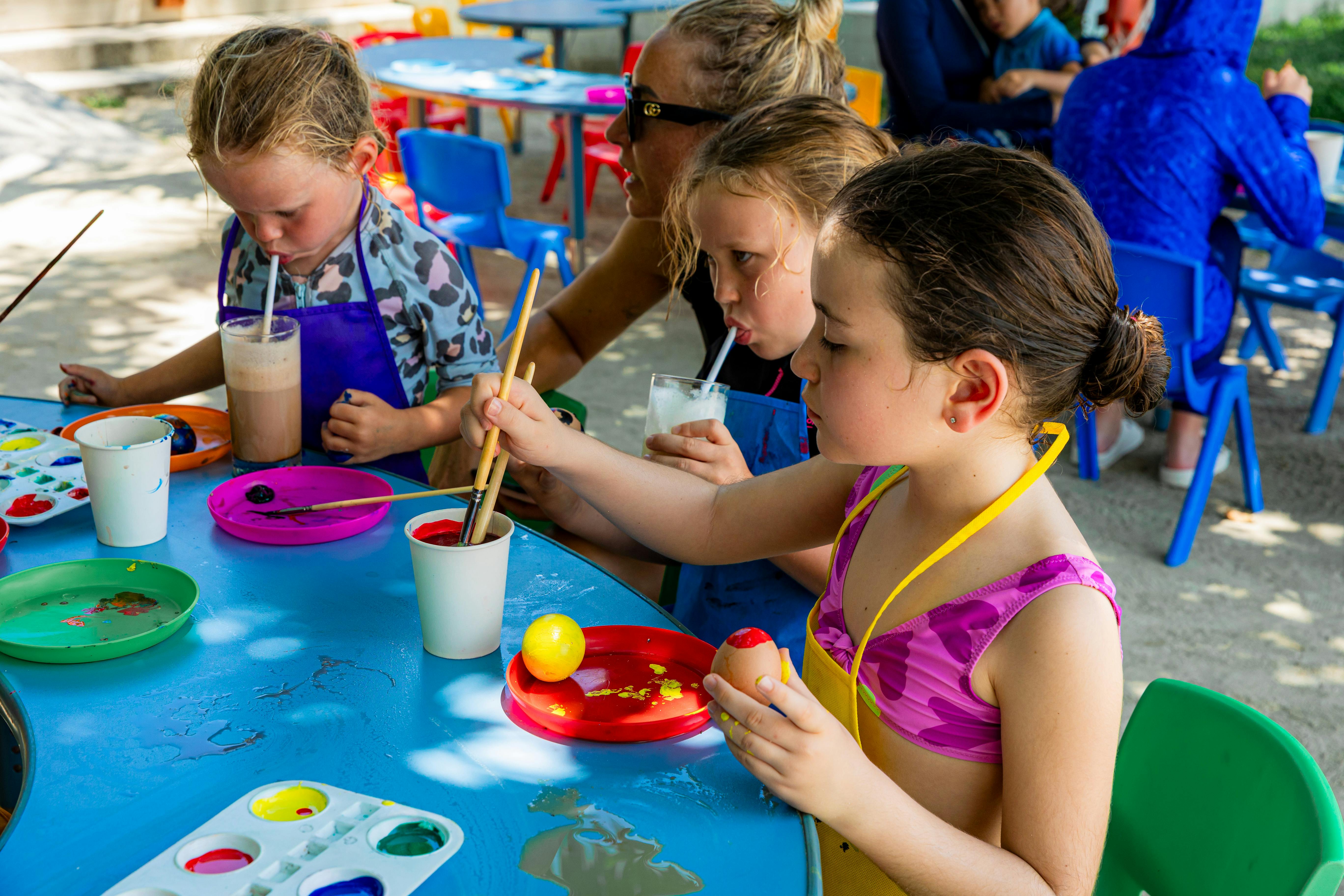 Children painting at outdoor event