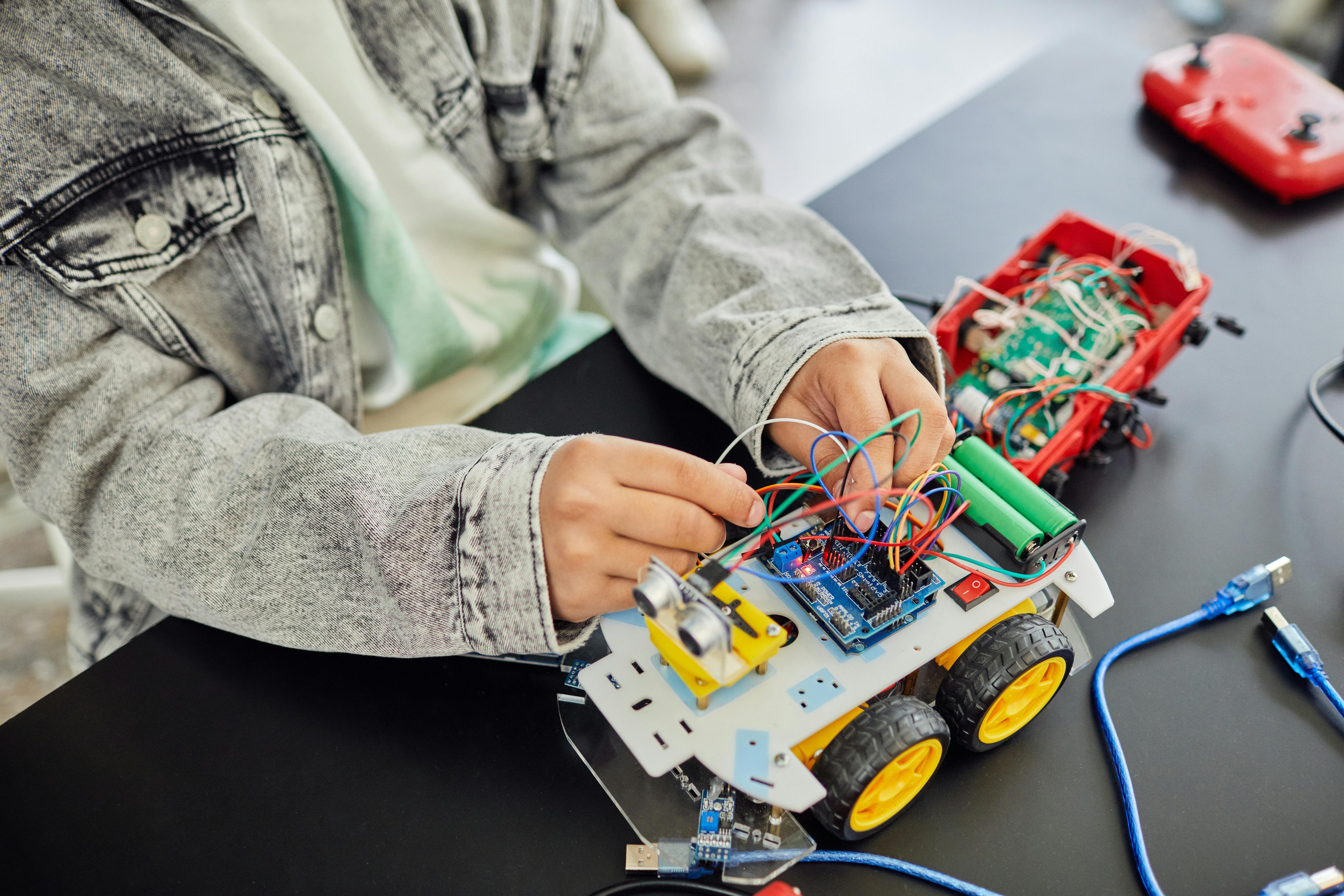 Student assembling toy car